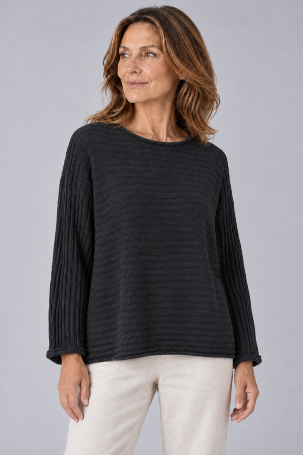 organic cotton jumper with long sleeves and ribbing in black colour presented on middle age woman