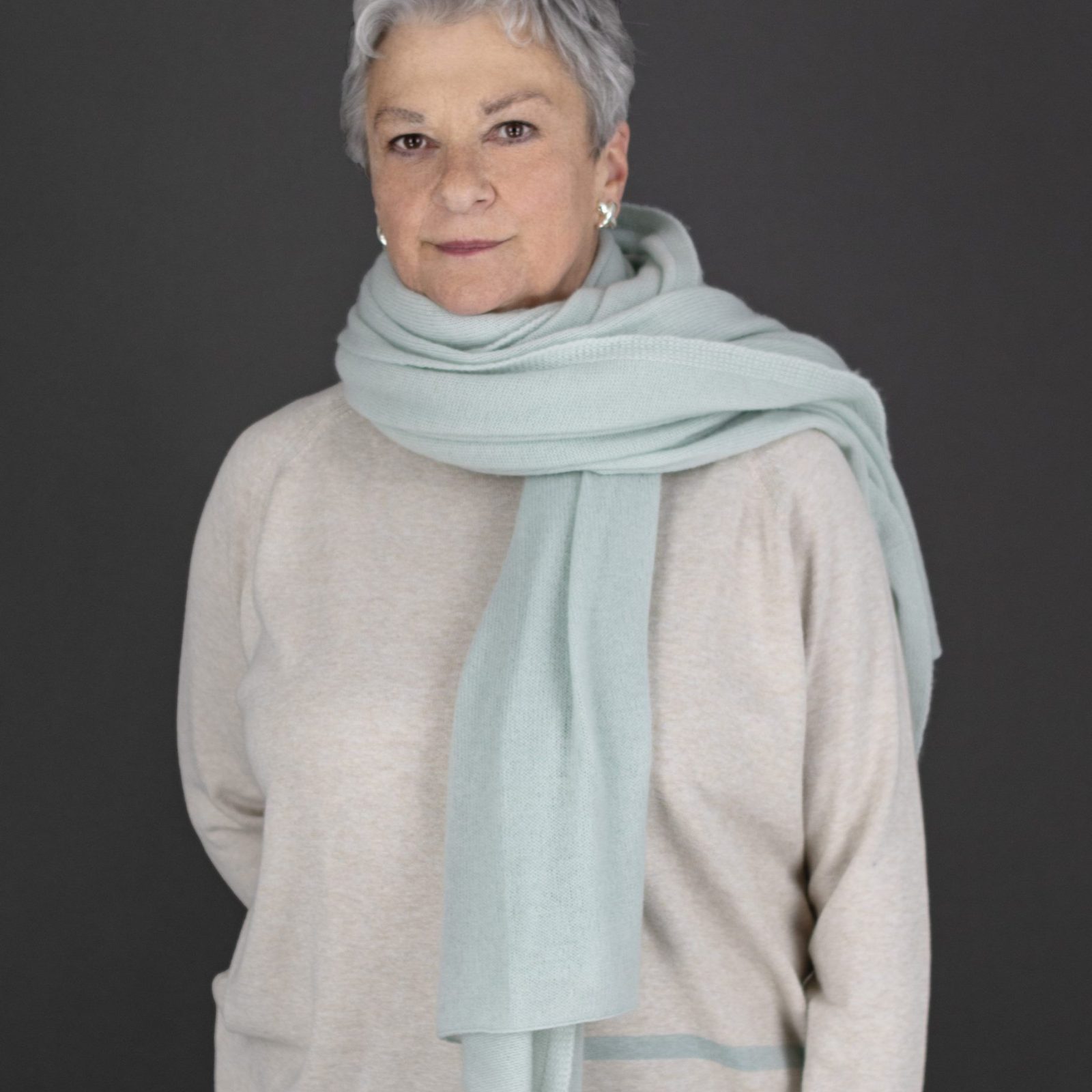 woman wearing travel wrap in mint colour
