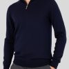 A jumper with long sleeves in navy color and a zipper.