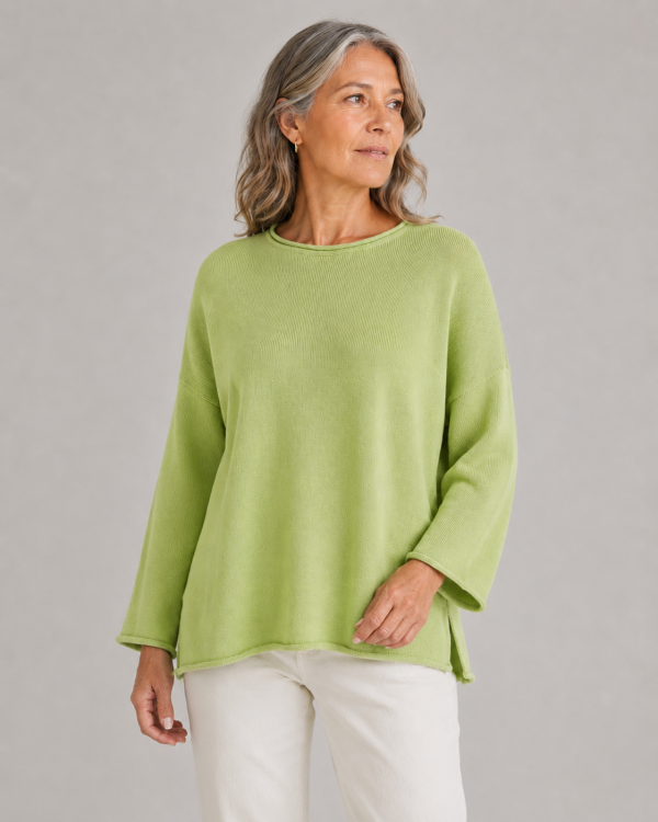cotton jumper with long sleeves in winter lime colour presented by woman