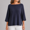 organic cotton jumper in navy colour presented by older woman