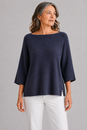 organic cotton jumper in navy colour presented by older woman