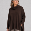 Carole-bitter-brown-model - Ochre Knitwear oversized jumper with turtle neck in bitter brown colour displayed by model