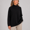 oversized jumper with long sleeves in black colour presented by model