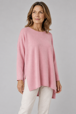 tunic top with long sleeves, boat neck and side split in monet pink colour front view, presented on middle aged woman