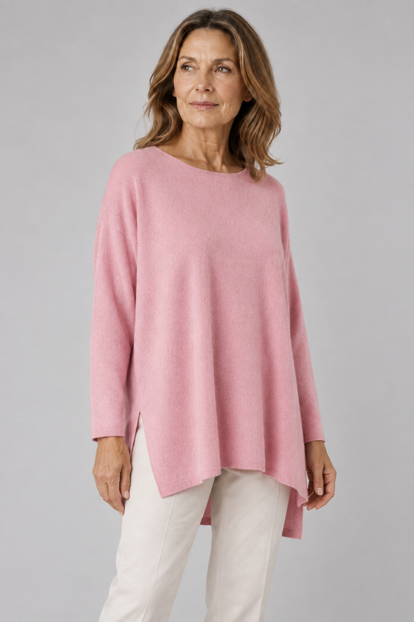 Greta-tunic-top-monet-pink-colour-front-view-model - Ochre Knitwear tunic top with long sleeves, boat neck and side split in monet pink colour front view, presented on middle aged woman