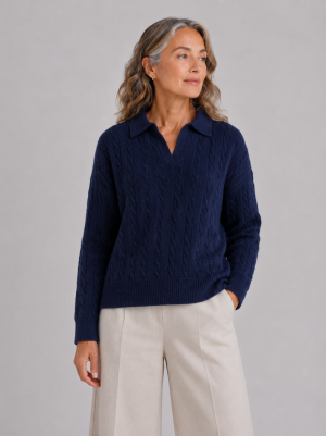 Model wearing the navy Cable Jumper with collared open neckline, all-over cable knit texture, ribbed hem and ribbed cuffs.