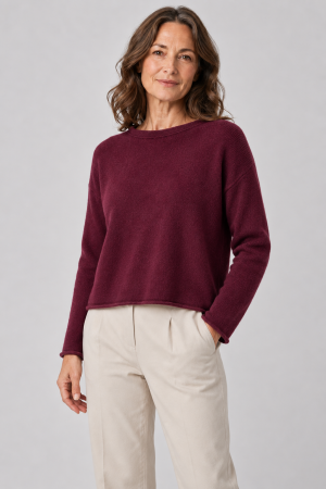 boat neck jumper with long sleeves in burgundy colour, front view presented by mature female model