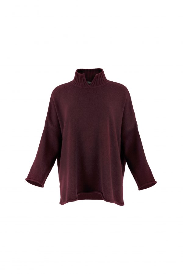 an oversized jumper featuring long sleeves, a high ribbed neckline, and a center front opening, presented in a burgundy colour, viewed from the front