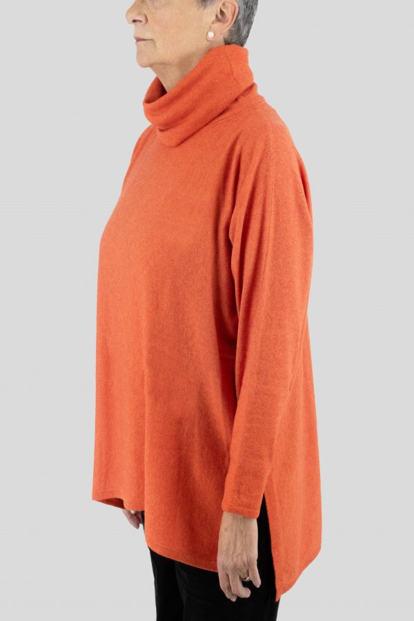 oversized jumper with turtle neck in flame colour side view