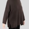 an oversized jumper featuring long sleeves, a high ribbed neckline, and a center front opening, presented in a chocolate colour, viewed from the side