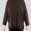 an oversized jumper featuring long sleeves, a high ribbed neckline, and a center front opening, presented in a chocolate colour, viewed from the front
