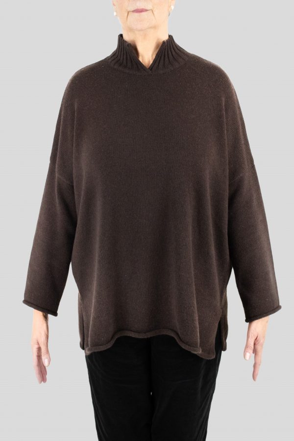 an oversized jumper featuring long sleeves, a high ribbed neckline, and a center front opening, presented in a chocolate colour, viewed from the front