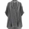 a mohair cardigan featuring short sleeves, two side pockets, and a cocoon shape, presented in a front view