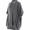 a mohair cardigan featuring short sleeves, two side pockets, and a cocoon shape, presented in a side view