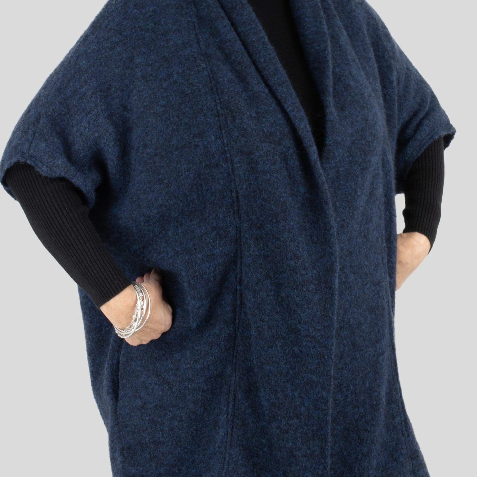 samba-mohair-cardigan-dark-navy-colour-side-view - Ochre Knitwear a mohair cardigan featuring short sleeves, two side pockets, and a cocoon shape, presented in a side view