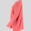 boat neck jumper with long sleeves, square bodice in coral colour, profile view
