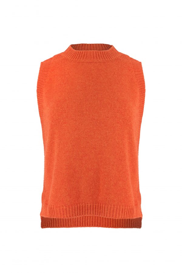 Lula knitted vest features round neck, sleeveless, longer at the back with side split in flame colour, front view