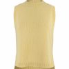 Lula knitted vest features round neck, sleeveless, longer at the back with side split in turmeric colour, front view