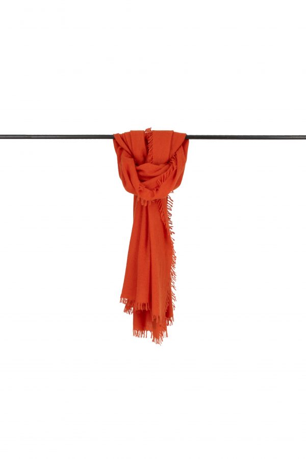 Cashmere-shawl-orange-draped - Ochre Knitwear Orange cashmere shawl with fringed edges, draped