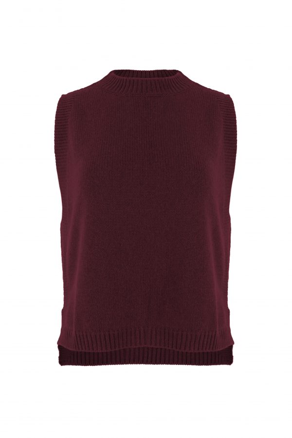 knitted vest features round neck, sleeveless, longer at the back with side split in burgundy colour, front view