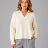 Rumble-collared-jumper-model - Ochre Knitwear collared cashmere blend jumper with open V neckline and dropped shoulders front view in buttermilk colour, presented by female mature model
