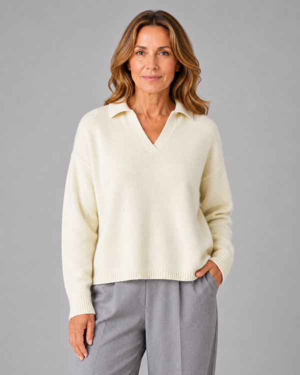 Rumble-collared-jumper-model - Ochre Knitwear collared cashmere blend jumper with open V neckline and dropped shoulders front view in buttermilk colour, presented by female mature model