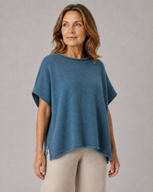 dropped sleeve cashmere blend knit gilet with curved hem front view, garment presented by female model