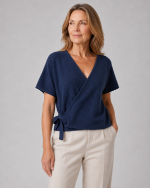 wrap-tie-knit-top-navy-front-model wrap tie knit top with front tie detail, navy colour, presented by mature female model