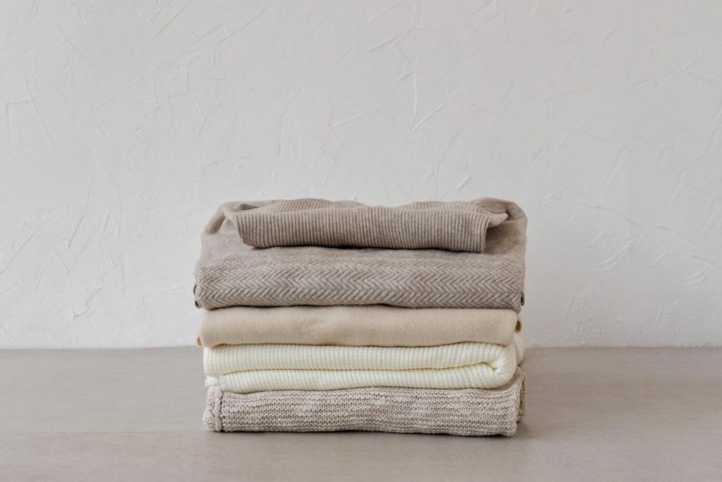 how to build a minimal cashmere wardrobe, folded various cashmere jumpers