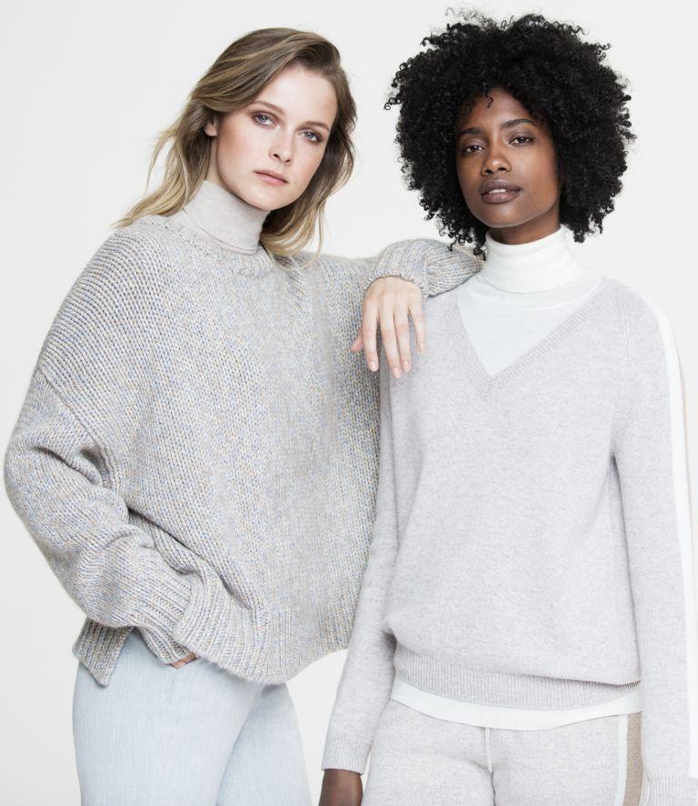 what to wear under cashmere sweater, two women wearing shirt under cashmere jumper