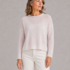 cropped boxy jumper in orchid ice cashmere blend with rolled neckline and relaxed long sleeves, presented by middle aged woman model