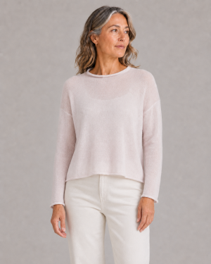 cropped boxy jumper in orchid ice cashmere blend with rolled neckline and relaxed long sleeves, presented by middle aged woman model
