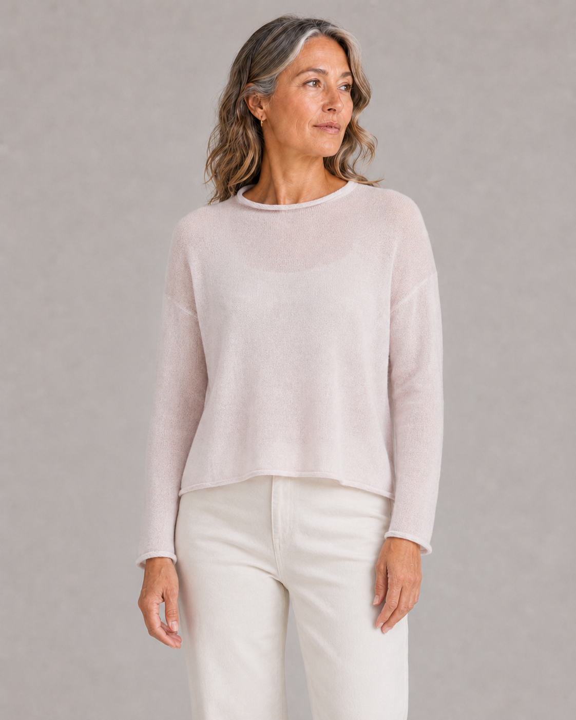 Egg cropped jumper: neckline and hem detail Ochre Egg cropped jumper in Orchid Ice, showing its wide rolled neckline and short relaxed hem