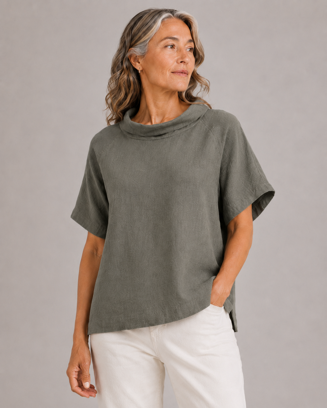 linen funnel neck top in fir green organic linen with folded collar and short sleeves, front view presented on women