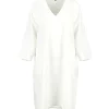 Jane-linen-tunic-dress-ivory-front - Ochre Knitwear linen tunic dress in ivory organic linen with V-neckline, three-quarter sleeves and relaxed longline shape, front view