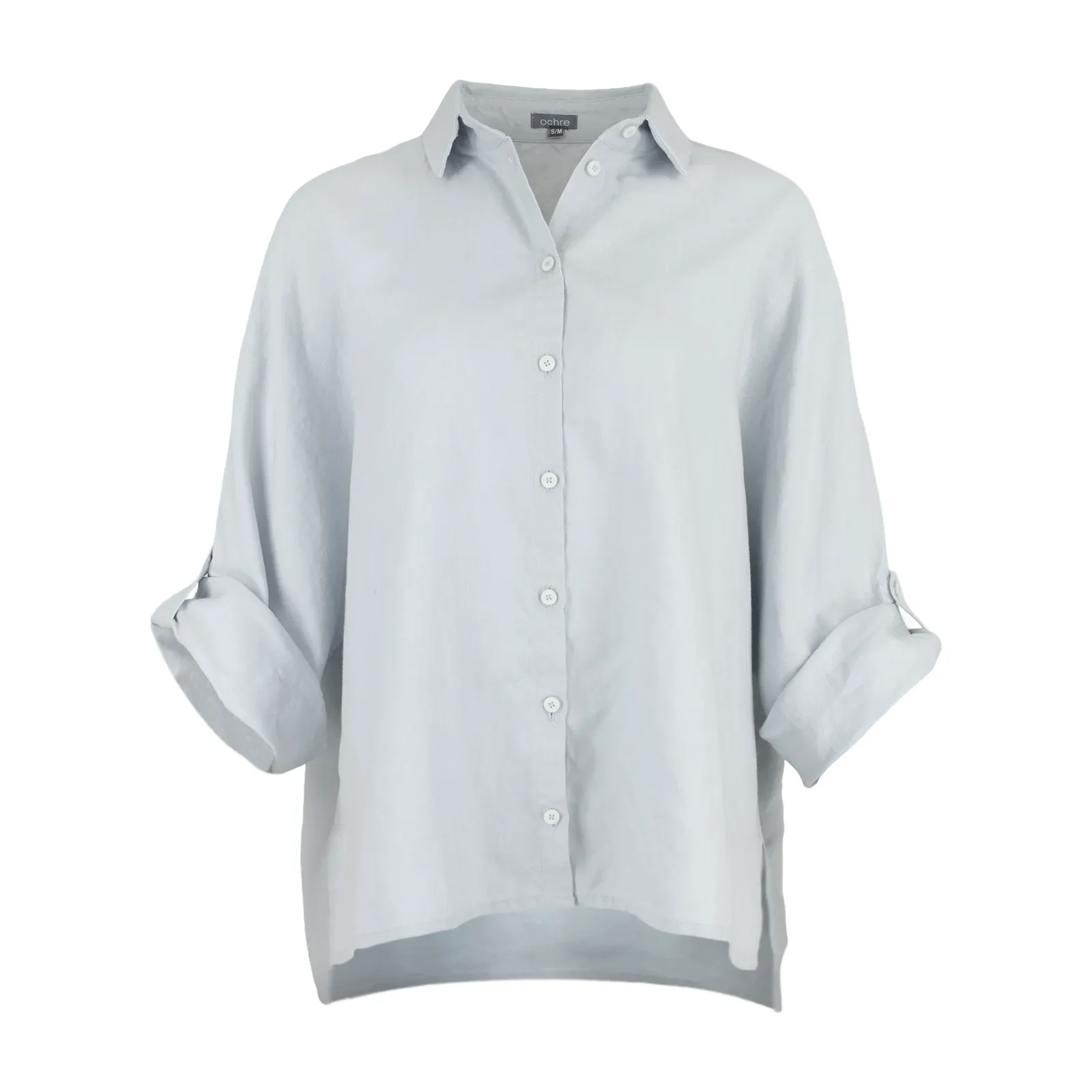 Linda-linen-shirt-pale blue-front-view - Ochre Knitwear Light blue button-down shirt on a torso mannequin with sleeves casually rolled up against a light gray background.