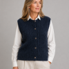 Percy-kid-mohair-buttoned-vest-navy-front-model - Ochre Knitwear kid mohair buttoned vest in navy with round neckline, five-button front, vertical rib texture and soft brushed mohair blend, presented by woman wearing it