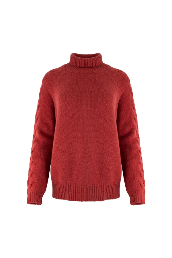 cable sleeve roll neck jumper with high ribbed collar, raised sleeve detail, deep ribbed hem and relaxed winter knit shape, in rust colour