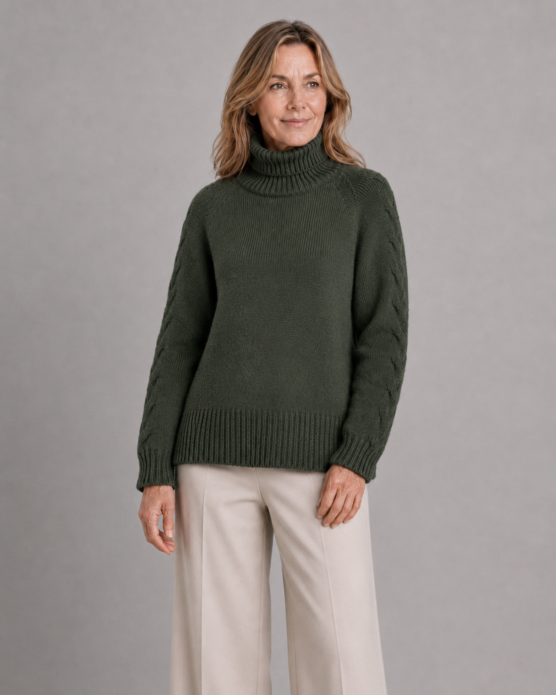 cable sleeve roll neck jumper with high ribbed collar, raised sleeve detail, deep ribbed hem and relaxed winter knit shape, presented by female model