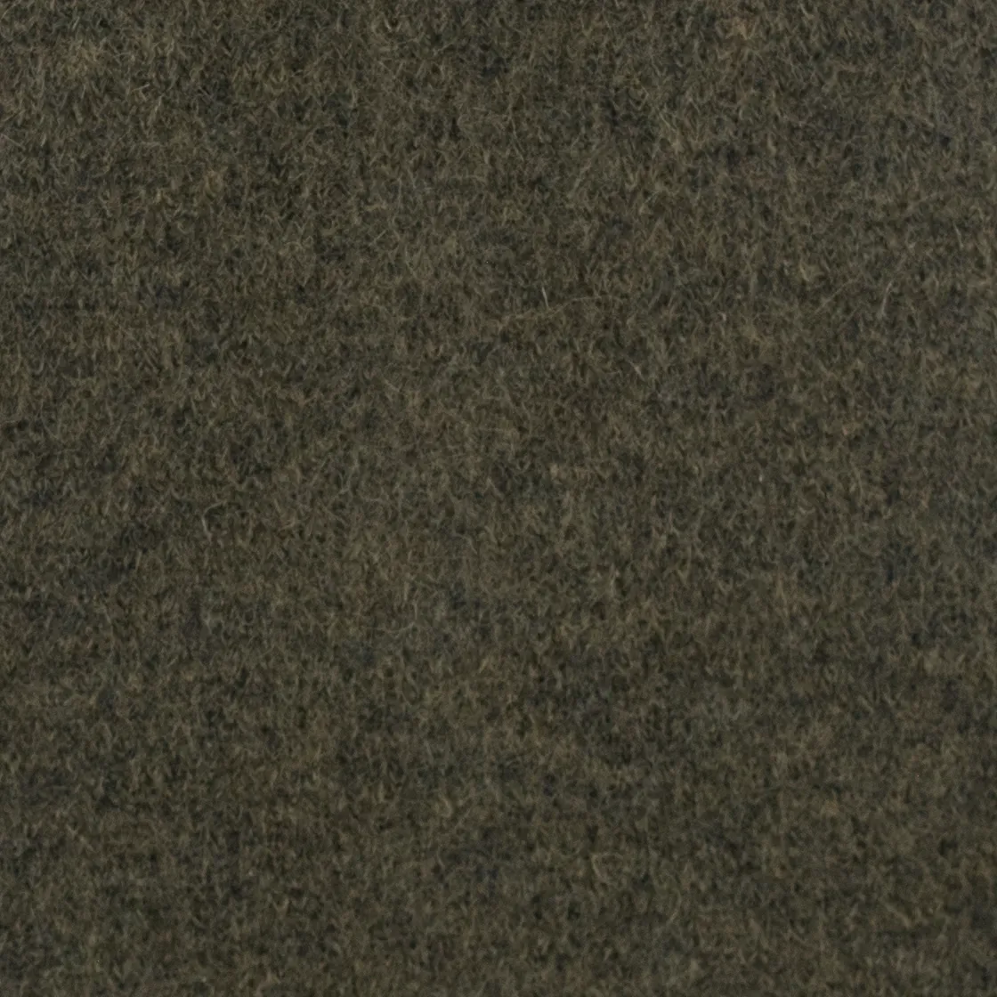 Close-up of a dark brown textured fabric surface (fuzzy wool/felt).