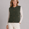 mina-sleeveless-buttoned-cardigan-front-fir-green-model - Ochre Knitwear sleeveless buttoned cardigan with round ribbed neckline, five front buttons, patch pockets and cropped sleeveless shape in fir green colour