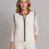 mohair zip gilet in ivory with contrast trim around the neckline, arm holes and zip front, shown from the front by brunette model