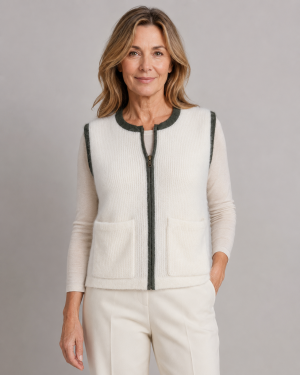 mohair zip gilet in ivory with contrast trim around the neckline, arm holes and zip front, shown from the front by brunette model