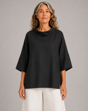 linen cowl neck top in black organic linen with folded neckline and wide short sleeves, presented by model, front view