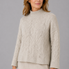 Fugu-textured-funnel-neck-jumper-stone-colour-front-model - Ochre Knitwear textured funnel neck jumper in stone colour with long sleeves presented by female model