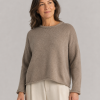 Rina-yak-wool-jumper-mocha-model - Ochre Knitwear yak wool jumper, showing the relaxed crew neckline, dropped shoulders and softly cropped fit, presented by female model