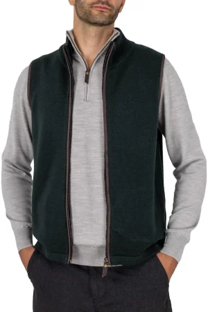 men’s merino gilet in ebony with brass front zip, ribbed stand collar, synthetic suede trim and two side pockets