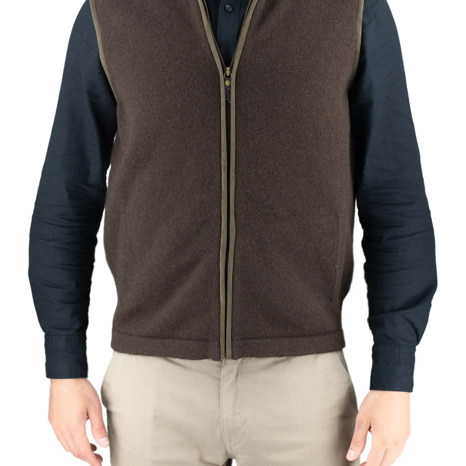 Person wearing a brown zip-front fleece vest over a dark long-sleeve shirt, shown from the waist up against a light background.