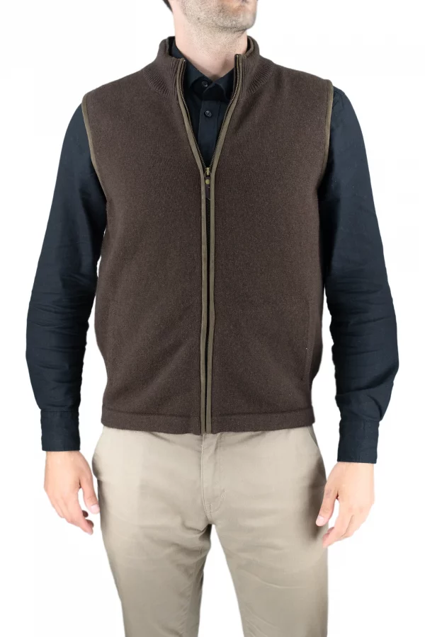 james-mens-yak-wool-zip-gilet-bitter-chocolate - Ochre Knitwear Person wearing a brown zip-front fleece vest over a dark long-sleeve shirt, shown from the waist up against a light background.
